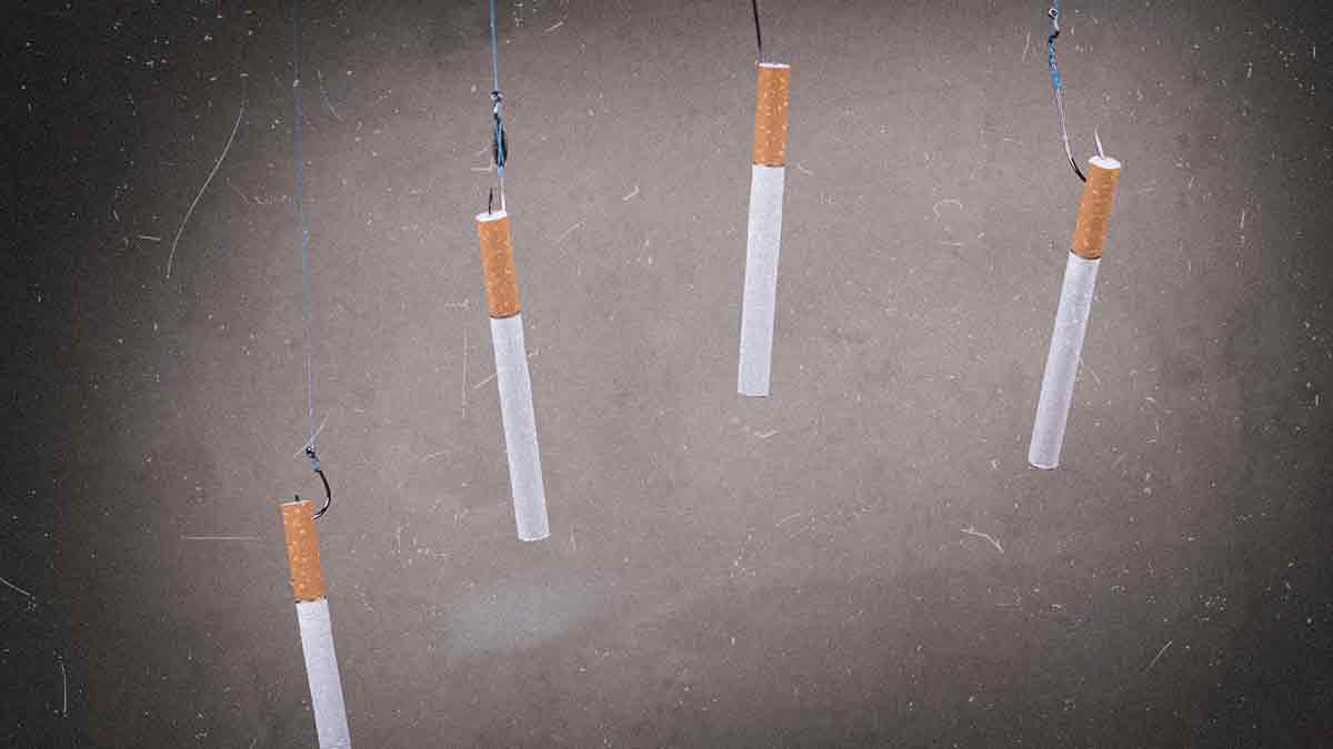 Cigarettes on fishing hooks showing how tobacco and menthol addict users