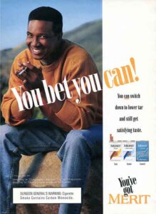 Ad that reads, "You bet you can! You can switch down to lower tar and still get satisfying taste. You've got Merit." A smiling man in a sweater holds a cigarette.